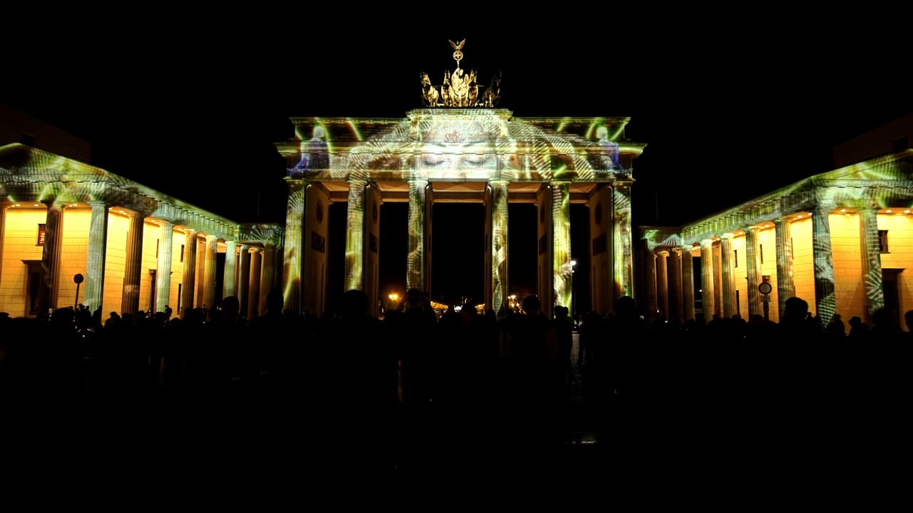 The Brandenburg Gate in Berlin covered in a golden 3D projection mapping during the Festival of Lights