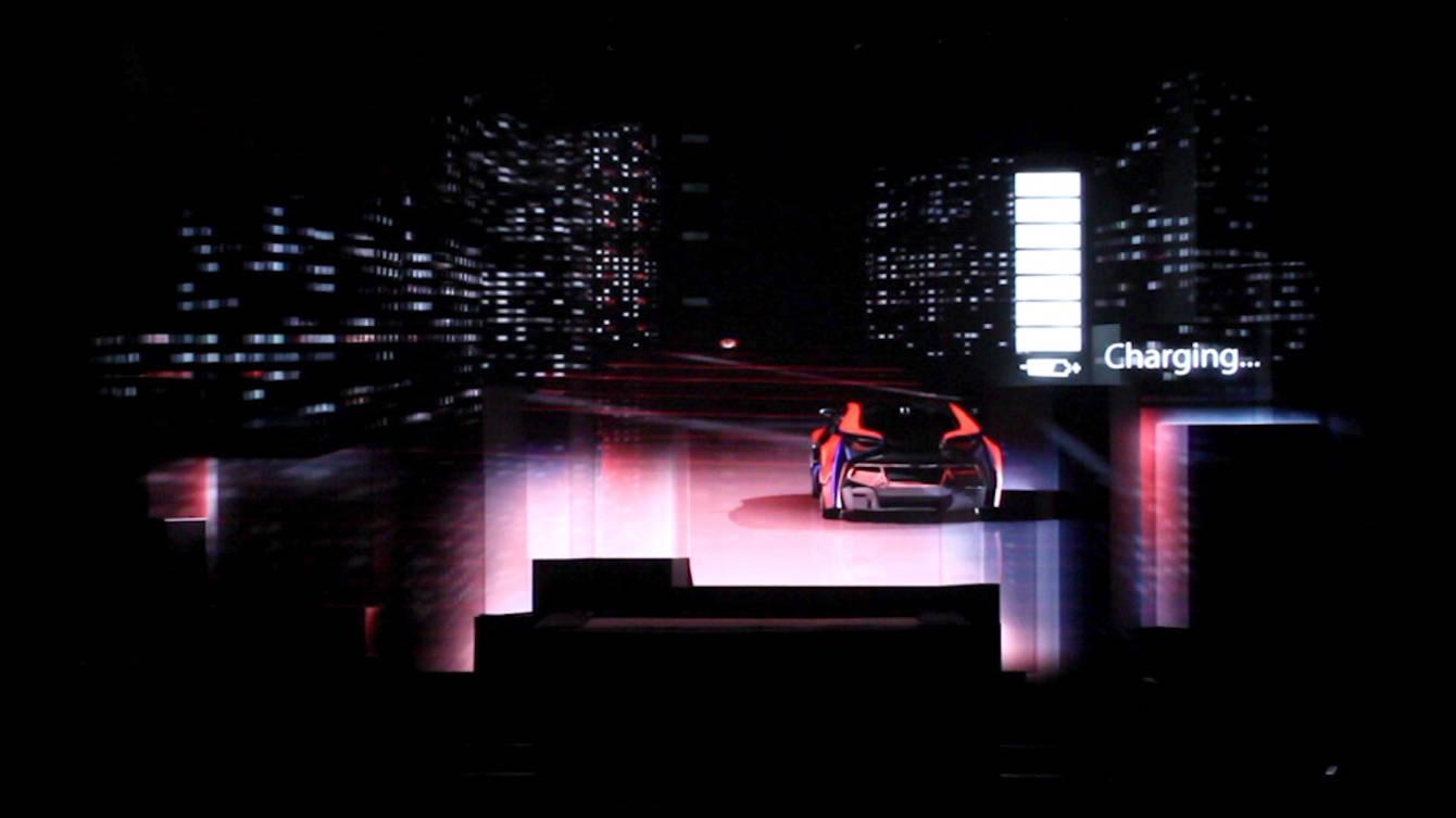 A stage of stacked projection-mapped cubes glowing blue during the Hannover Messe opening ceremony