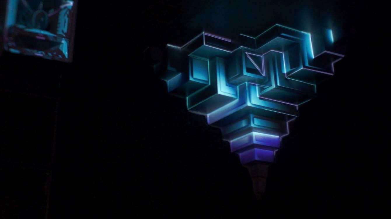 A geometric stage structure inside the Juice Club Hamburg lit by projection-mapped animations