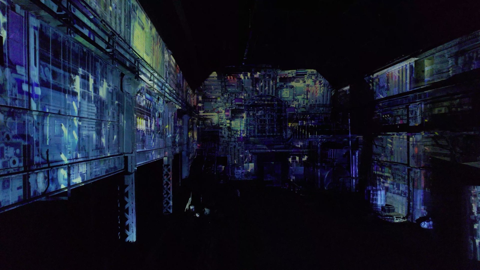 The brick walls of the MaHalla industrial hall in Berlin wrapped in a blue and cyan 270-degree projection mapping