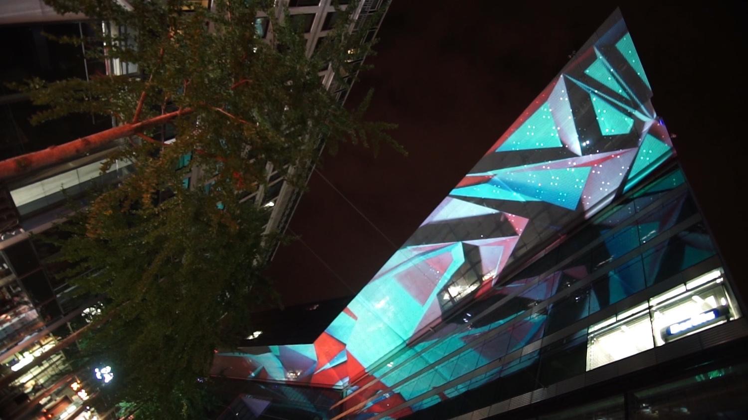The glass ceiling of the Neues Kranzler Eck business centre in Berlin animated with geometric projection mapping
