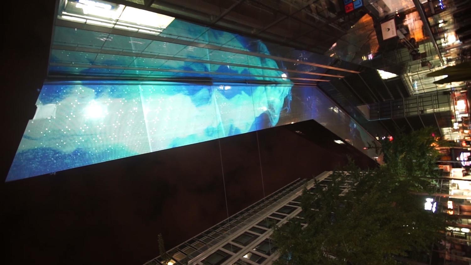 The glass ceiling of the Neues Kranzler Eck business centre in Berlin animated with geometric projection mapping