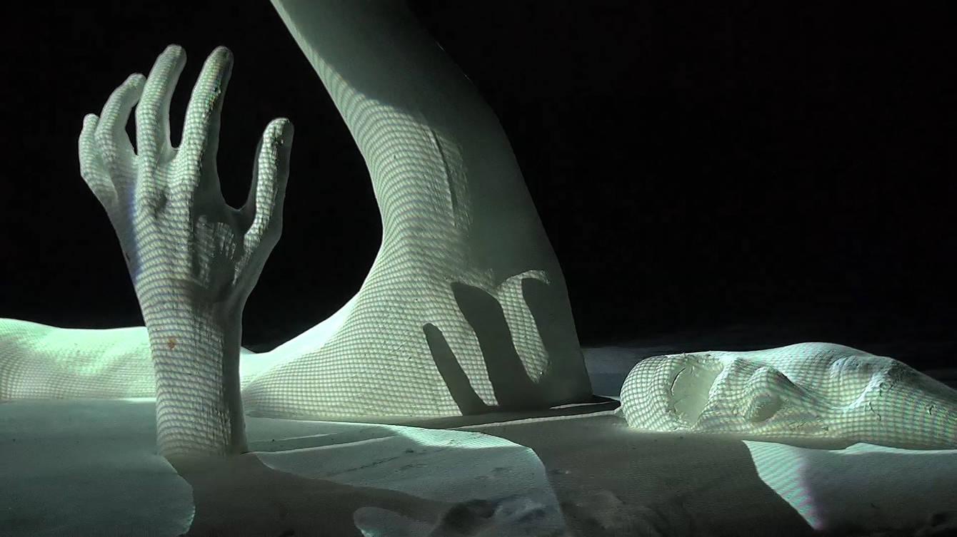A sculpture by the artist Monarch.Ohne at Urban Spree Berlin lit by projection mapping