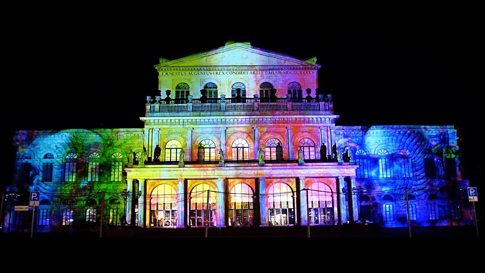 The neoclassical façade of the Hannover State Opera lit in blue and white by a 3D projection mapping