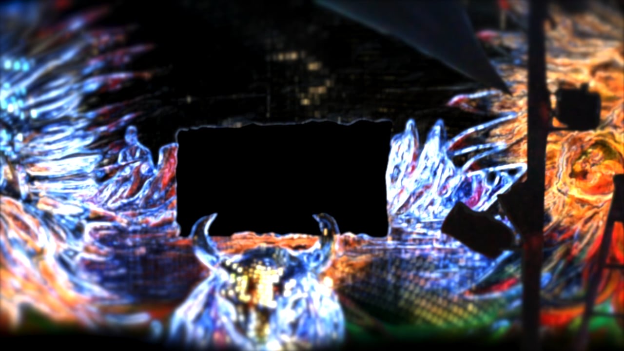 An open-air festival stage covered in a glowing 3D illusion projection mapping at night