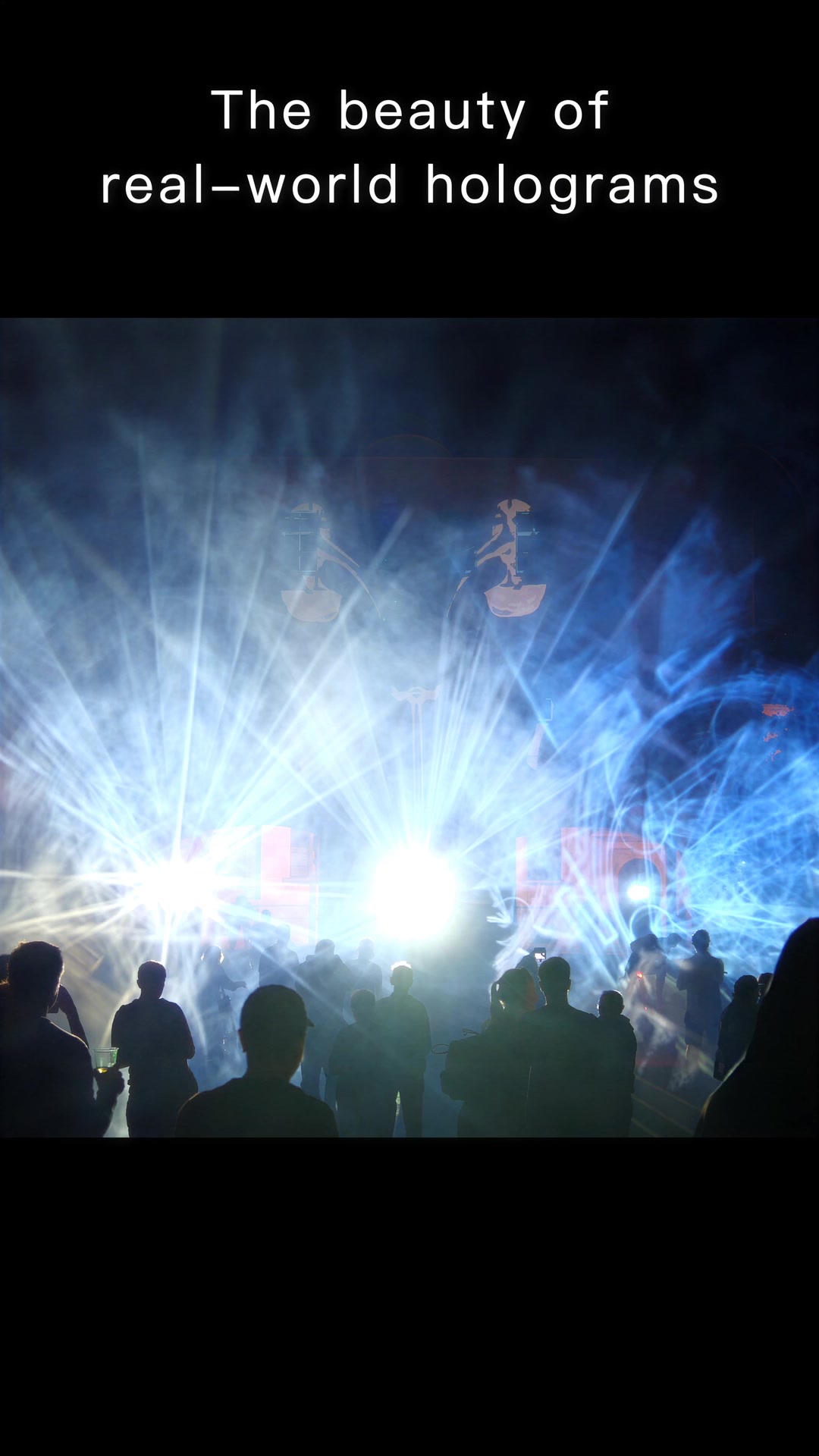 People standing in front of a bright white and blue hologram of light in fog on a square in Weimar at night, filmed in vertical format
